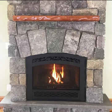 Granite Fireplace with Sculpted Sapele Mantle. Stone sourced from Champlain Stone in Whitehall, New York. Mantle wood sourced from Northern Hardwoods.